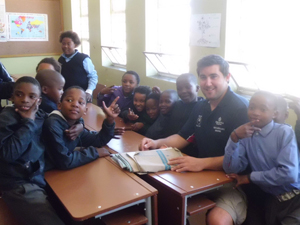 World Champion John Roe with the schoolchildren of Siyafuneka Township school